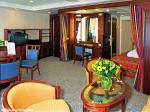 ID 2794 AURORA (2000/76152grt/IMO 9169524) - A suite comprising lounge area with sofa, armchairs, dining table and chairs, vanity/writing desk, full length windows to private balcony, separate bedroom area...